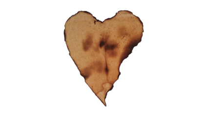 Old burnt paper heart, isolated, symbolizing lost love or damage