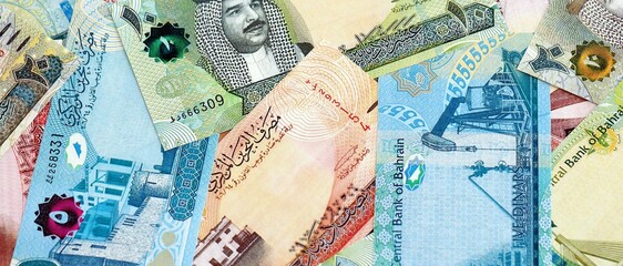 Bahraini dinar currency money bills. The current banknotes lies on table in big amount close up