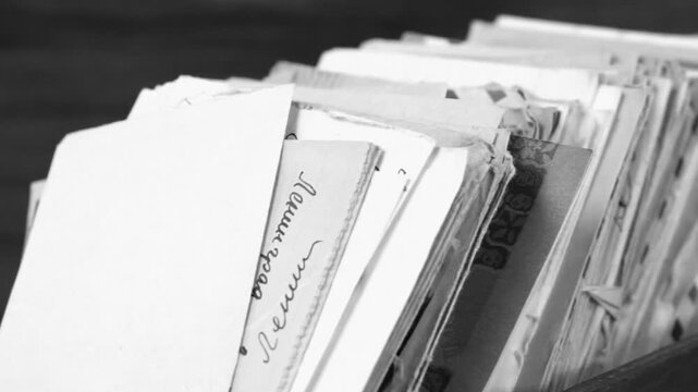 Many postal paper letters in the wooden box black and white.  Text: "Leningrad"