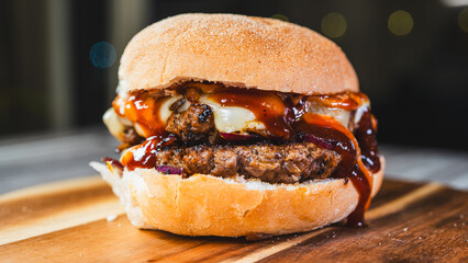 Delicious cheese burger with homemade sauces, presented on a beautiful wooden board. Juicy, flavorful, and perfect for gourmet fast food promotions and menus.