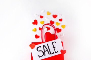 Valentine day sale and shopping background . Red paper shopping bag with text sale, white, red,...