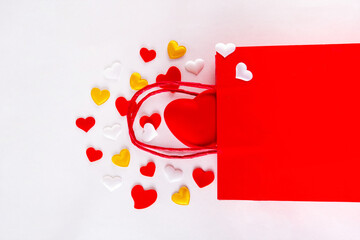 Valentine day sale and shopping background . Red paper shopping bag with text sale, white, red,...