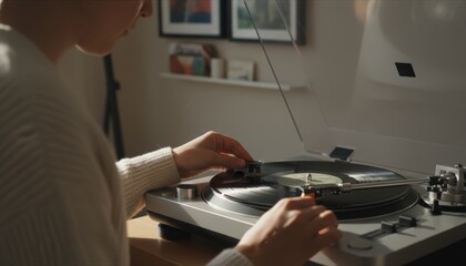 Person's hands carefully placing the needle of a modern turntable onto a spinning black vinyl record in a cozy, sunlit room, enjoying a relaxing moment with analog music