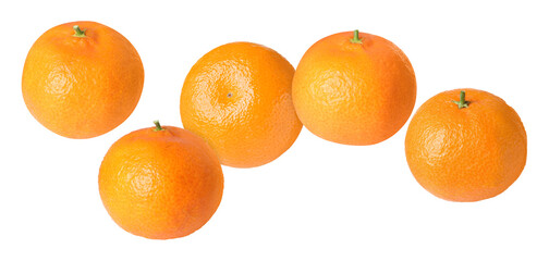 Fresh tangerines falling on white background. Citrus fruit