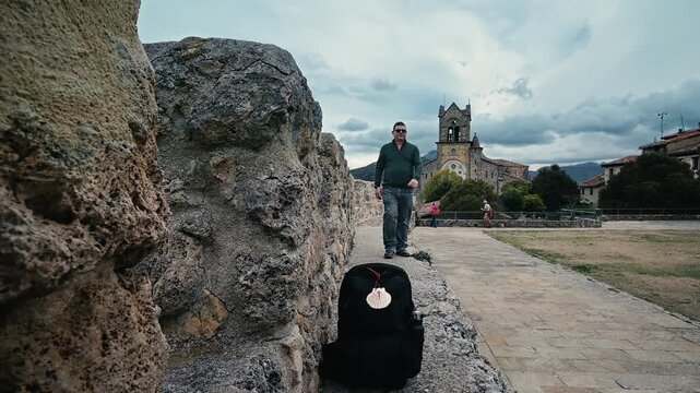 Pilgrim walking the Way of St. James in Frias, Spain