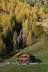 Stunning mountain scenery in fall with old farmhouse at sunrise, Osttirol region, Tyrol, Austria