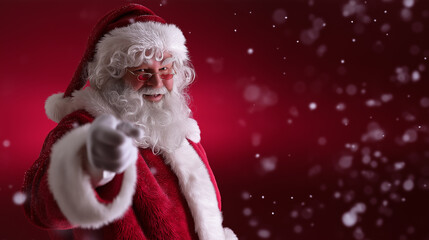 Naklejka premium A classic Santa Claus pointing directly at the viewer against a red snowy background. 