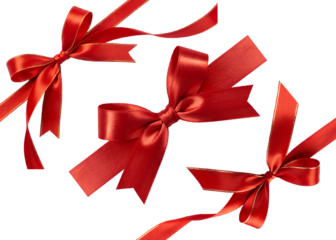 Three festive red satin ribbons and bows with subtle glitter accents on a transparent background