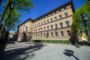 Obraz premium Latvian Parliament Building in Riga on May 5, 2024 – Saeima Architecture and National Flags on Historic Street