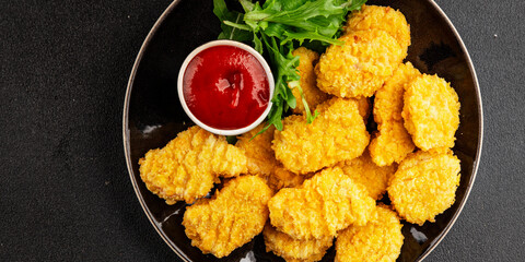 Chicken nuggets fast food natural tasty appetizer fresh delicious gourmet food background on the table rustic top view copy space