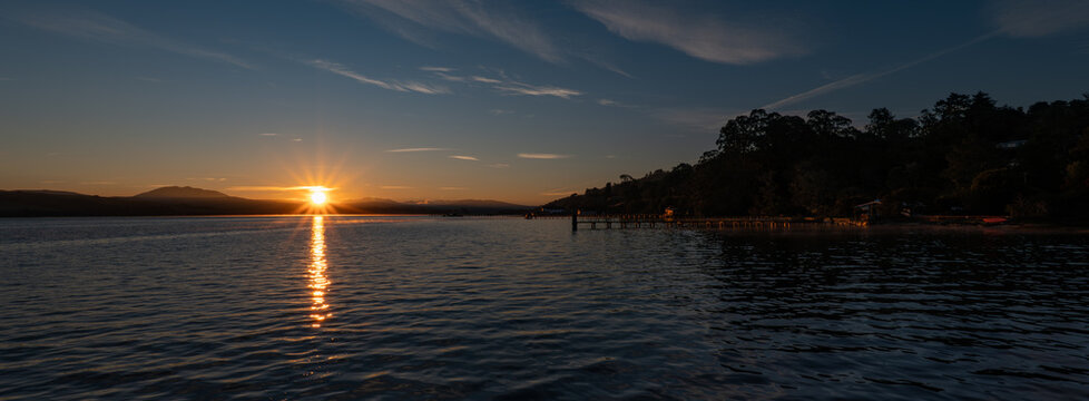 Dramatic Sunrise Over Tomales Bay, California, with Pier Silhouette