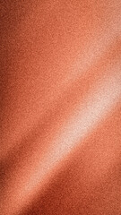 Abstract warm vertical background with a vibrant diagonal light strike, featuring a rich grainy blur texture in striking orange, brown, and white hues