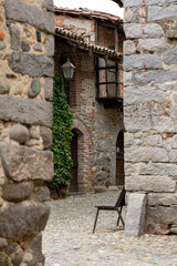A narrow "rua" (cobblestone street) inside the Ricetto di Candelo, a fortified medieval village in Piedmont. 