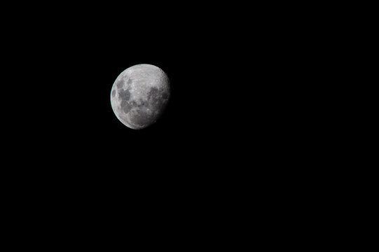 Bright full moon illuminating the dark night sky with visible lunar craters in space - Powered by Adobe