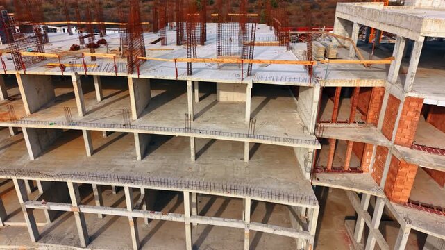 Flight along the empty floors of the big building of the unusual design. New hotel construction.