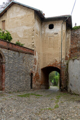 An ancient and evocative medieval gate located in the Borgo del Piazzo, the historic district of Biella, Piedmont.