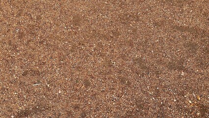 Little mini pebbles texture. Orange brown natural background.