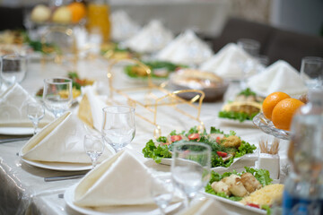 Wedding table with cutlery and food on table.