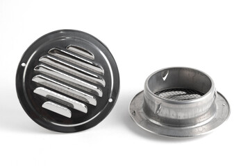 Round stainless steel ventilation grate on white background.