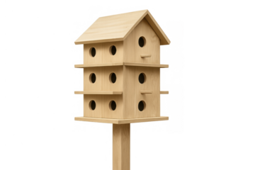 Wooden birdhouse standing on a pole with multiple nesting holes and perches, providing a home for garden birds