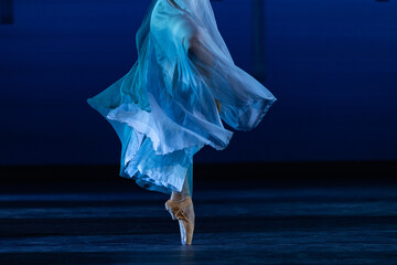 Ballerina En Pointe on Dark Stage