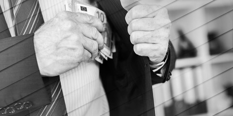 Businessman removing banknotes from his pocket, geometric pattern