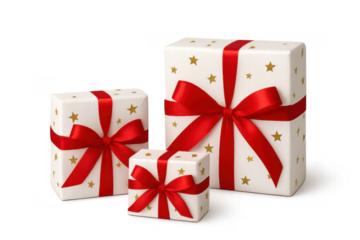 Three white gift boxes of various sizes, decorated with golden stars and tied with vibrant red satin bows. Transparent background