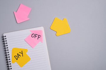 Day off reminder on clipboard and calendar. Scheduling a break.