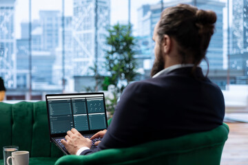 Visionary entrepreneur sits in a high end corporate workspace, focusing on investment planning and business development. Young CEO optimizing productivity to drive enterprise success.