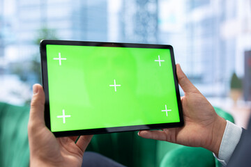 Goal oriented CEO reviews isolated mockup on tablet focusing on investment planning, ensuring...
