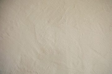 Wall with smooth surface and light texture in indoor environment during daytime