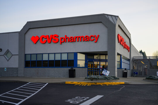 Kenmore, WA, USA - November 30, 2025; Corner entrance of CVS pharmacy store with logo and red text