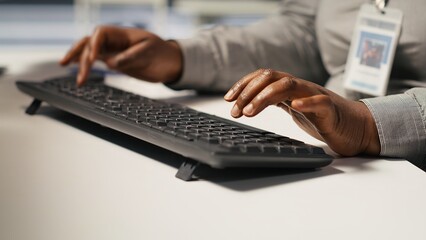 Close up of data center admin coding, writing script on PC identifying bottlenecks. Server farm IT expert typing on computer keyboard, troubleshooting bugs, implementing optimizations, camera A