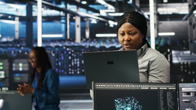 Annoyed data center IT expert having malfunctioning gear while using node tree tool. Frustrated server hub technician upset by errors while using AI visualization to optimize system health, camera B