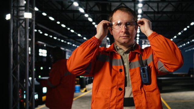 Technician overseeing welding machinery in industrial workshop, highlighting labor power, metal fabrication and protective gear use. Heavy industry plant for manufacturing process.