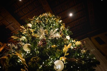 Festive Indoor Christmas Tree with Ornaments and Lights