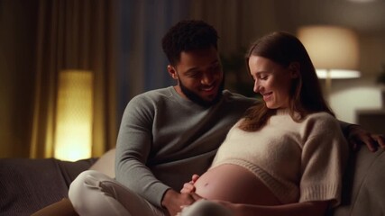 A loving couple expecting a baby, creating an unforgettable memory with touch and smiles in the cozy home environment. It is a moment of anticipation, warmth, and the start of a family Stock Video