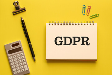 There is notebook with the word GDPR. It is an abbreviation for General Data Protection Regulation...