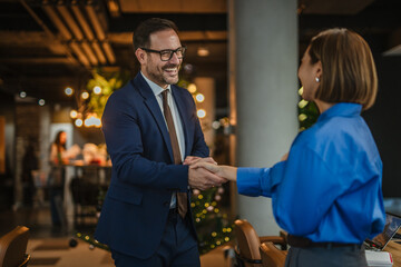 Business professionals shaking hands completing successful deal © Miljan Živković