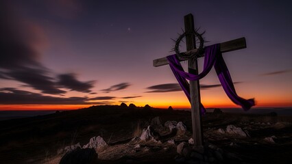 Cross with Purple Cloth Draped Over Wooden Structure at Sunset or Sunrise in Natural Landscape