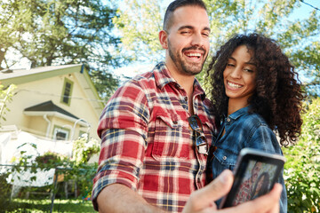 Fototapeta premium Couple, laugh and selfie at backyard, online and memory for social media post, bonding and together. Outdoor, man and woman with smile for picture, photography and interracial marriage, love or home