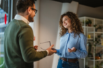Fototapeta premium Colleagues having informal business conversation in modern office