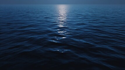 Obraz premium Tranquil Reflection of Moonlight on Calm Ocean at Night Over Serene Waters Under Clear Sky Creating Peaceful Atmosphere and Soothing Mood
