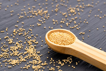 Amaranthus - Raw amaranth seeds in a measuring spoon