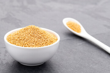 Raw amaranth seeds in a bowl and spoon - Amaranthus