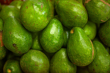Green avocados in top-down view