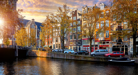 Amsterdam, Netherlands. Bridge over channel houses river Amstel landmark old european city Autumn landscape.