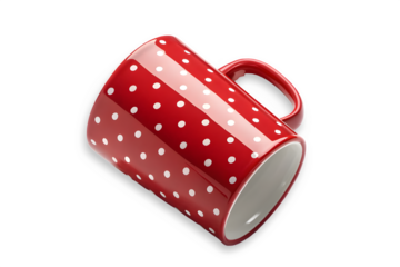 Red ceramic mug with white polka dots isolated on transparent background