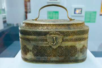 An antique Turkish bronze box stands closed.