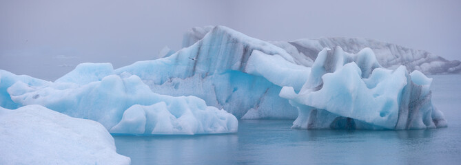 Panoramic view of large Ice burgs floating on Jokulsarlon glacier lagoon, Iceland.